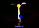 The Spin Copter: LED Slingshot Helicopter, featuring vibrant LED lighting in a sleek design. It showcases a colorful spinning top with two propellers, ideal for outdoor fun and entertainment.