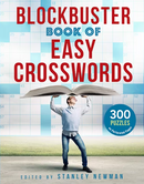 A cheerful young man holds up the Blockbuster Book of Easy Crosswords, showcasing its large format. The book features bold text and an image of a crossword grid in the background, promising 300 crossword puzzles on perforated pages.