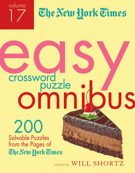 Cover of the NYT Easy Crossword Omnibus Volume 17 featuring the title in bold colorful letters. The design includes an image of a slice of chocolate cake topped with a cherry and mint leaf. Edited by Will Shortz, this volume offers 200 solvable puzzles from The New York Times.