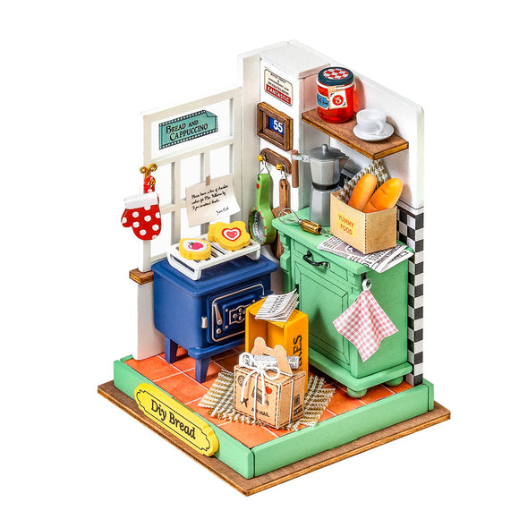 A charming DIY kit titled 'DIY Afternoon Baking Time' by Robotime, featuring a miniature kitchen scene with a blue stove, green cabinets, and baking supplies. The setup includes decorated cookies on a tray, a note on the wall, and vibrant kitchen items, inviting creativity and hands-on baking fun.