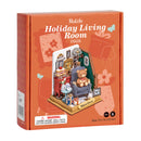 The DIY Holiday Living Room by Robotime is a charming miniature kit featuring a cozy living room scene. It showcases a comfy armchair, a teddy bear, delicious treats on a table, holiday decorations, and more, perfect for holiday-themed crafting. The vibrant packaging captures the festive spirit with playful designs and clear product information.