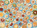 A colorful jigsaw puzzle titled 'Desserts of the States' featuring an array of illustrated desserts from different states. Each state is represented with its signature dessert, surrounded by bright blue backgrounds and decorative elements. The center displays the title prominently, creating a whimsical and engaging visual experience.