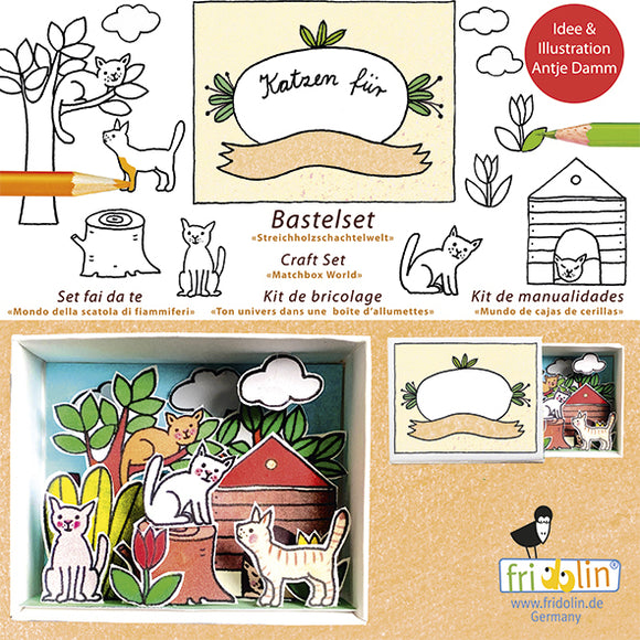 Matchbox Kit Cat Family DIY kit by fridolin, featuring colorful illustrations of cats, trees, and a playful design. The kit includes craft materials for creating a whimsical cat-themed environment, suitable for all ages. A great way to spark creativity and engage in a fun, hands-on activity.