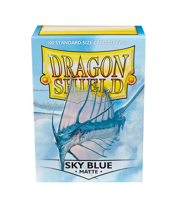 A pack of Dragon Shields featuring 100 standard size card sleeves in a matte sky blue finish. The design includes a majestic dragon against a soft blue background, showcasing durability and style for card protection.