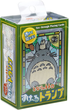 Transparent Totoro Playing Cards by Ensky, featuring a clear design and colorful illustrations of Totoro. The packaging shows a playful design and highlights the see-through feature, making these playing cards a unique addition to any card game collection.