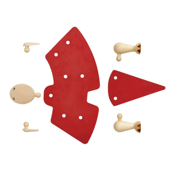 A DIY Tyrannosaurus kit from Plan Toys, featuring wooden pieces in red and natural wood colors for assembly. The kit includes body parts, connectors, and a head to create a dinosaur figure, ideal for creative play and development skills.