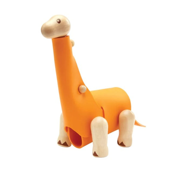 A DIY Brachiosaurus kit from Plan Toys, featuring an orange dinosaur model made of sustainable wood, with movable parts that inspire creativity and imaginative play.