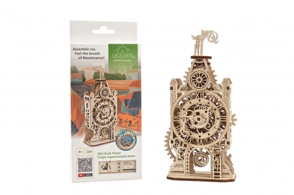 UGears 3D Old Clock Tower DIY kit featuring intricately designed mechanical parts. The tower showcases a large clock face with moving gears, decorated with a small figure at the top. The product packaging is visible in the background, highlighting the creative assembly process and the model's artistic appeal.