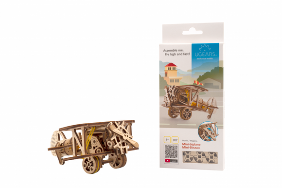 UGears 3D Mini Biplane DIY kit displayed. The model features intricate wooden parts showcasing mechanical design and is ready to be assembled. The packaging highlights the product and includes assembly instructions.