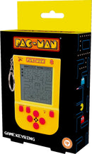 Pac-Man Keyring Arcade Game featuring colorful design with a vibrant yellow casing, a mini screen displaying the classic game maze, and buttons for gameplay. The packaging showcases the famous Pac-Man characters and includes a keyring attachment for easy portability.