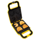 A cheerful Pac Man Waffle Maker by Fizz Creations Inc. in yellow and black. The waffle maker is open, showcasing whimsical shapes of Pac Man and ghost characters, perfect for making fun, nostalgic breakfast treats. The non-stick cooking surfaces feature detailed impressions, providing a playful twist to your meals.