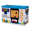 Tetris Waffle Maker by Fizz Creations Inc. featuring a colorful box design with the Tetris logo. The waffle maker is designed to create waffles in the shape of Tetriminos, adding a fun twist to breakfast or brunch. Perfect for game enthusiasts and anyone looking to enjoy unique, creative waffles.
