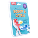Teeny Town Scoop and Catch game by Fizz Creations Inc. featuring two colorful tiny scoops, one red and one blue, along with a small yellow ball. The packaging is bright and playful, showcasing the game's fun and engaging nature, ideal for kids. Instructions and safety warnings are visible on the back.