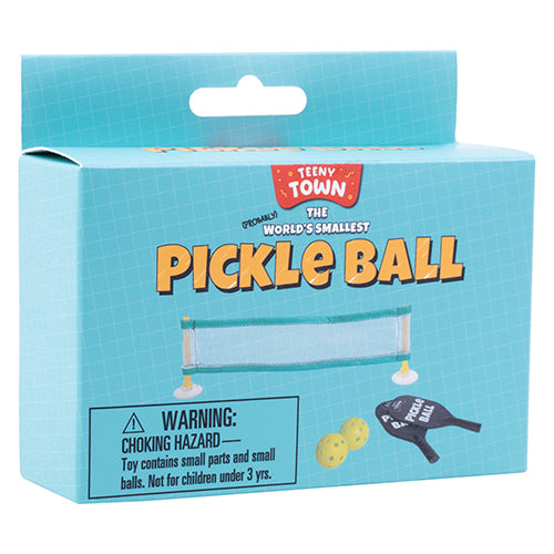 The World's Smallest Pickle Ball game by Fizz Creations Inc. features a compact set with a tiny net, miniature paddles, and small balls. The colorful packaging showcases the game's title and includes a warning label about choking hazards, indicating that it contains small parts and is not suitable for children under 3 years. Perfect for fun on the go or as a quirky gift.