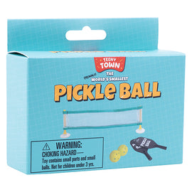 The World's Smallest Pickle Ball game by Fizz Creations Inc. features a compact set with a tiny net, miniature paddles, and small balls. The colorful packaging showcases the game's title and includes a warning label about choking hazards, indicating that it contains small parts and is not suitable for children under 3 years. Perfect for fun on the go or as a quirky gift.