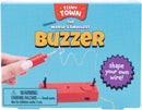 Teeny Town Buzzer Game by Fizz Creations Inc. features a bright red device with a wire and buzzer. The packaging highlights the fun text 'shape your own wire!' along with a warning for small parts. Ideal for creative play and challenges, this game is designed for both kids and adults, encouraging problem-solving and fine motor skills.