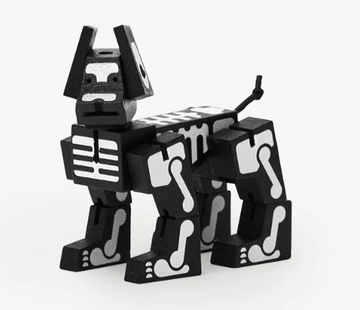 Cubebot Milo in black skeleton design, a mechanical puzzle shaped like a dog. The figure features movable limbs and a playful appearance, ideal for both decoration and creative play.