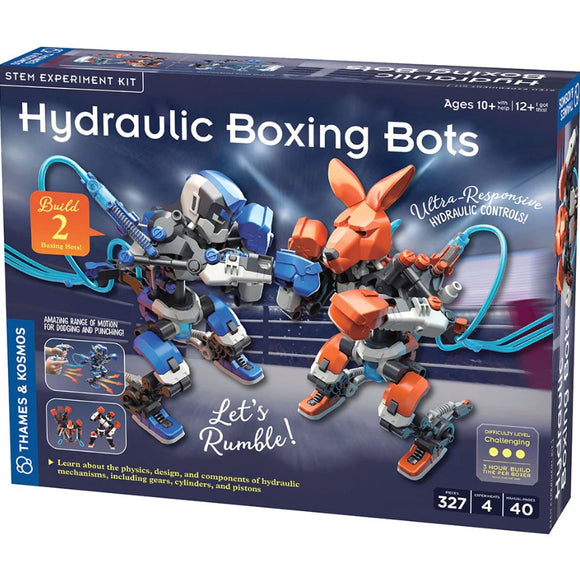The Hydrolic Boxing Bots DIY kit by Thames & Kosmos, featuring a colorful box design. The image displays two hydraulic boxing robots, one gray and blue, the other orange and brown, positioned in a boxing stance with visible hydraulic controls. The box highlights key features like 'Let's Rumble!', 'Ultra-Responsive Hydraulic Controls', and is suitable for ages 10 and up. It includes 327 pieces for a challenging build.