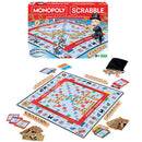 Monopoly Scrabble game by Winning Moves displayed on a table. The image shows the game board featuring a colorful grid with letter tiles, property cards, and player pieces including the iconic Monopoly character. The packaging is visible in the background, depicting a fun design. A black bag containing additional components is also included.