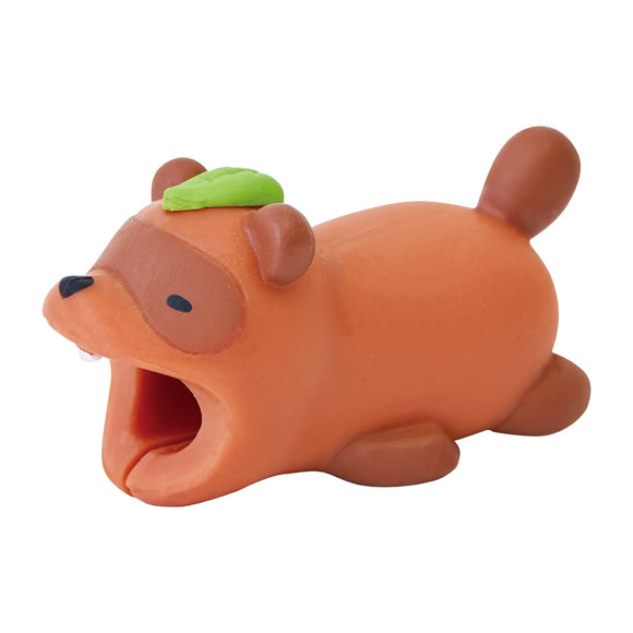 A playful raccoon-shaped cable bite in a vibrant orange color. The figure has a green leaf on its head and an open mouth design, ideal for protecting charging cables from wear and tear. Its cute and whimsical appearance adds a fun touch to any desk or tech setup.