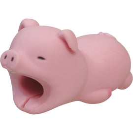 A cute pink pig-shaped Cable Bite USB-C accessory by Dreams USA, ideal for protecting charging cables with its playful design. The pig features a large open mouth that fits snugly around a USB-C cable, providing both decoration and functionality.