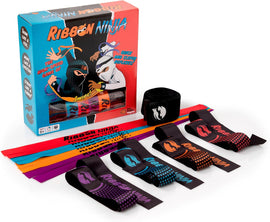 The Ribbon Ninja game by Fat Brain features a colorful box with a comic-style design. Inside, there are four playful ribbons in various colors (red, purple, blue, and orange) alongside a black wristband labeled 'Ribbon Ninja.' This 4-player game encourages quick reflexes and strategic thinking, perfect for ages 8 and up.