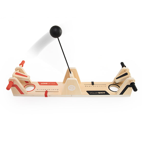 VolleyShot game by Fat Brain featuring a wooden game board with two scoring areas and a black ball suspended by a thin stick. The game combines elements of strategy and skill, making it an exciting option for family fun and friendly competitions.