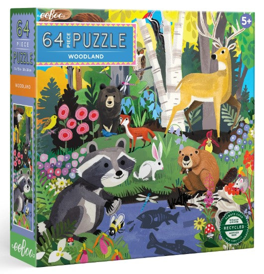 Eeboo Woodland jigsaw puzzle box featuring a vibrant illustration of woodland animals including a raccoon, deer, bear, rabbit, and a variety of colorful plants. The puzzle contains 64 pieces and is suitable for ages 5 and up. The artwork showcases a lively natural scene with a river, trees, and flowers, promoting creativity and learning.