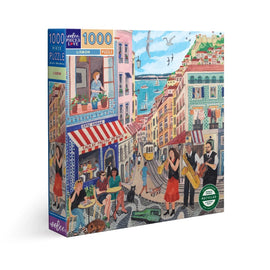 Eeboo's 'Lisbon' jigsaw puzzle featuring a vibrant street scene from Lisbon. The puzzle box displays colorful illustrations of musicians, cafes, and seaside views, inviting puzzlers into the charming culture of the city. With 1000 pieces, it offers a delightful challenge for adults and families alike.