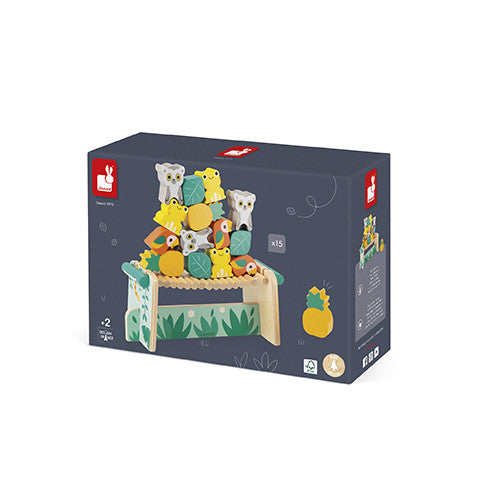 The Tropik Balancing Games by Juratoys features colorful wooden pieces shaped like animals and fruits, designed for stacking and balancing. The product packaging showcases a vibrant design with illustrations of the game elements and an engaging, playful theme, making it appealing for children aged 2 and up.