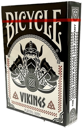 A box of Vikings-themed playing cards by Bicycle, featuring a striking design of a Viking warrior, swords, and intricate patterns. The box is predominantly black and white with red accents, showcasing the word 'VIKINGS' prominently on the front.
