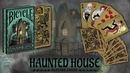 A deck of Bicycle Haunted House playing cards featuring a spooky Victorian house illustration on the cover. The cards showcase unique horror-themed artwork, including characters like a ghostly woman and a jester, in a beautifully designed pack suitable for collectors and game enthusiasts.