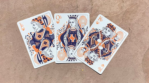 A set of Bicycle Snail (Orange) Playing Cards, displaying three royal face cards: the King, Queen, and Jack, artistically illustrated in vibrant orange and navy designs. The cards feature whimsical snail motifs and ornate patterns, making them a unique addition to any card game collection.