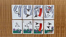 A display of several Bicycle Sparrow Hanafuda cards from US Playing Card Co. The cards feature beautiful illustrations of sparrows and floral designs, rendered in vibrant colors against a white background. The card faces showcase various symbols used in Hanafuda games, making them a perfect choice for both traditional and modern gameplay.