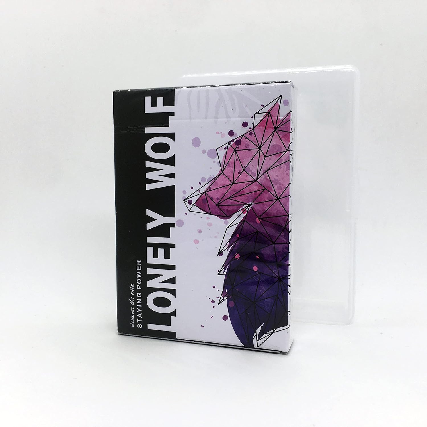 Lonely Wolf (Purple) Playing Cards by BOCOPO. The front of the card box features a geometric purple wolf design with bold text stating 'LONELY WOLF' and a stylized artistic flair. The box is partially transparent, highlighting the artistic theme of the cards inside.