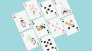 A colorful set of Pure Milk Playing Cards by Hanson Chien Production Co. The cards display playful illustrations of cute animals, hearts, and whimsical designs on a light blue background. Various values and suits are visible, showcasing a fun and imaginative style suitable for gaming enthusiasts.