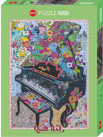 Colorful jigsaw puzzle box featuring a vibrant quilt art design of a grand piano surrounded by an assortment of flowers and musical notes. The artwork, by Laura Heine, showcases intricate patterns and a vivid color palette, intended to delight puzzle enthusiasts as they piece together this 1000-piece challenge.