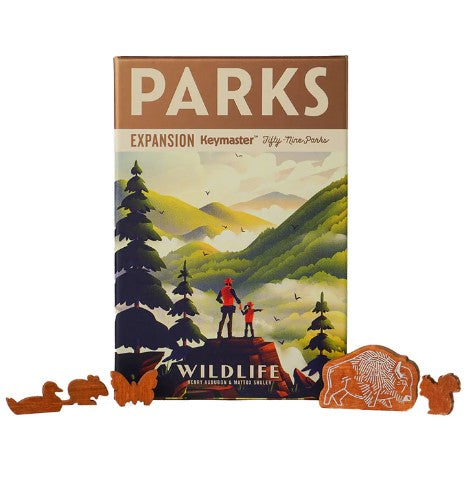 Parks - Wildlife Expansion board game by Keymaster Games, featuring a scenic mountain landscape on the box cover. Includes wooden animal tokens like a bison and ducks, enhancing gameplay with nature-themed elements.