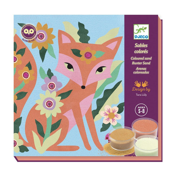 Colorful art kit featuring a fox design by Tara Lilly. The kit includes containers of colored sand in various shades, ideal for creating vibrant artwork. The packaging showcases a playful illustration of a fox surrounded by flowers and foliage, perfect for children aged 5-8.