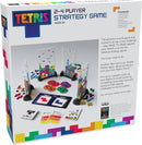 Tetris strategy game for 2-4 players, ages 8+. Includes colorful Matrix Towers, base pieces, Tetriminos, achievement cards, and game board. Players challenge each other by completing rows and scoring points. The vibrant box features iconic Tetris branding.