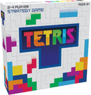 Tetris board game box design by Buffalo Games, featuring vibrant colors and a dynamic logo. Suitable for 2-4 players and ages 8 and up, the box showcases a strategy game with iconic Tetris shapes.