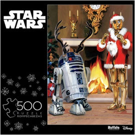 500-piece jigsaw puzzle featuring R2-D2 wearing reindeer antlers and C-3PO in a Santa outfit, set in a cozy holiday-themed room with a fireplace and Christmas decorations.