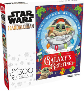 Galaxy's Greetings jigsaw puzzle featuring Grogu from Star Wars: The Mandalorian. The box showcases Grogu in a festive setting with Christmas lights and gifts, promoting a holiday theme.