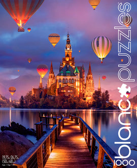 The Mystic Kingdom jigsaw puzzle by Blanc Puzzles features a stunning scene of a majestic castle surrounded by colorful hot air balloons against a vibrant sunset sky. The artwork showcases intricate details of the castle's architecture, shimmering reflections on the lake, and a wooden pathway leading into the enchanting landscape. Ideal for puzzle enthusiasts, this 1000-piece puzzle offers an immersive experience in assembling this magical view.