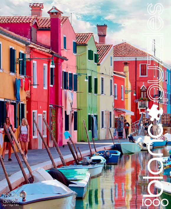 A vibrant jigsaw puzzle featuring the picturesque Canals of Burano, Italy, showcasing colorful houses along the waterfront. The scene includes women walking beside the canal and boats docked along the shore, reflecting the beautiful colors of the buildings. This image captures the essence of Italy's charming architecture and tranquil waterways.