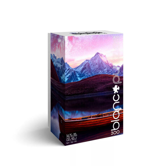 A jigsaw puzzle box titled 'Calm Boat' by Blanc Puzzles, featuring a serene landscape with a calm lake and majestic mountains in soft pastel colors, suitable for ages 14 and up. The puzzle contains 300 pieces designed to create a beautiful image of a wooden boat reflecting on the water under a twilight sky.