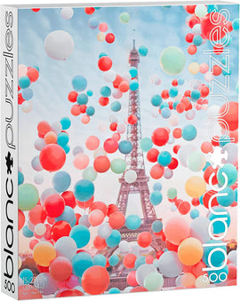 Eiffel Tower Balloons jigsaw puzzle by Blanc Puzzles featuring a vibrant image of the Eiffel Tower surrounded by colorful balloons in shades of red, blue, and pastel. The puzzle consists of 500 pieces and is designed for ages 14 and up. The artwork captures a playful and cheerful atmosphere, perfect for puzzle lovers.