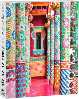 Blanc Puzzles jigsaw puzzle 'Tiles for Miles, Spain' featuring a vibrant image of intricately designed columns with colorful patterns. The puzzle consists of 500 pieces and dimensions of 15 x 21.25 inches. Perfect for puzzle enthusiasts and art lovers.