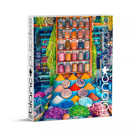 A vibrant box of the 'Moroccan Spices' jigsaw puzzle by Blanc Puzzles. The cover features an array of colorful spices and herbs displayed in jars and bowls, reflecting the rich culture and culinary heritage of Morocco. Ideal for puzzle enthusiasts who appreciate vibrant imagery and cultural themes.