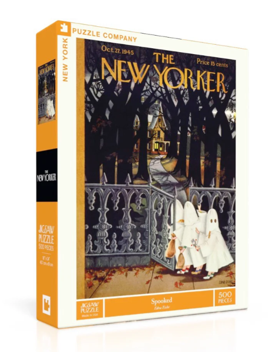 Spooked jigsaw puzzle by New York Puzzle Company features a New Yorker magazine cover illustration depicting a spooky Halloween scene with ghostly figures near a gate and a haunted house background. The puzzle consists of 500 pieces, showcasing vibrant colors and intricate details.